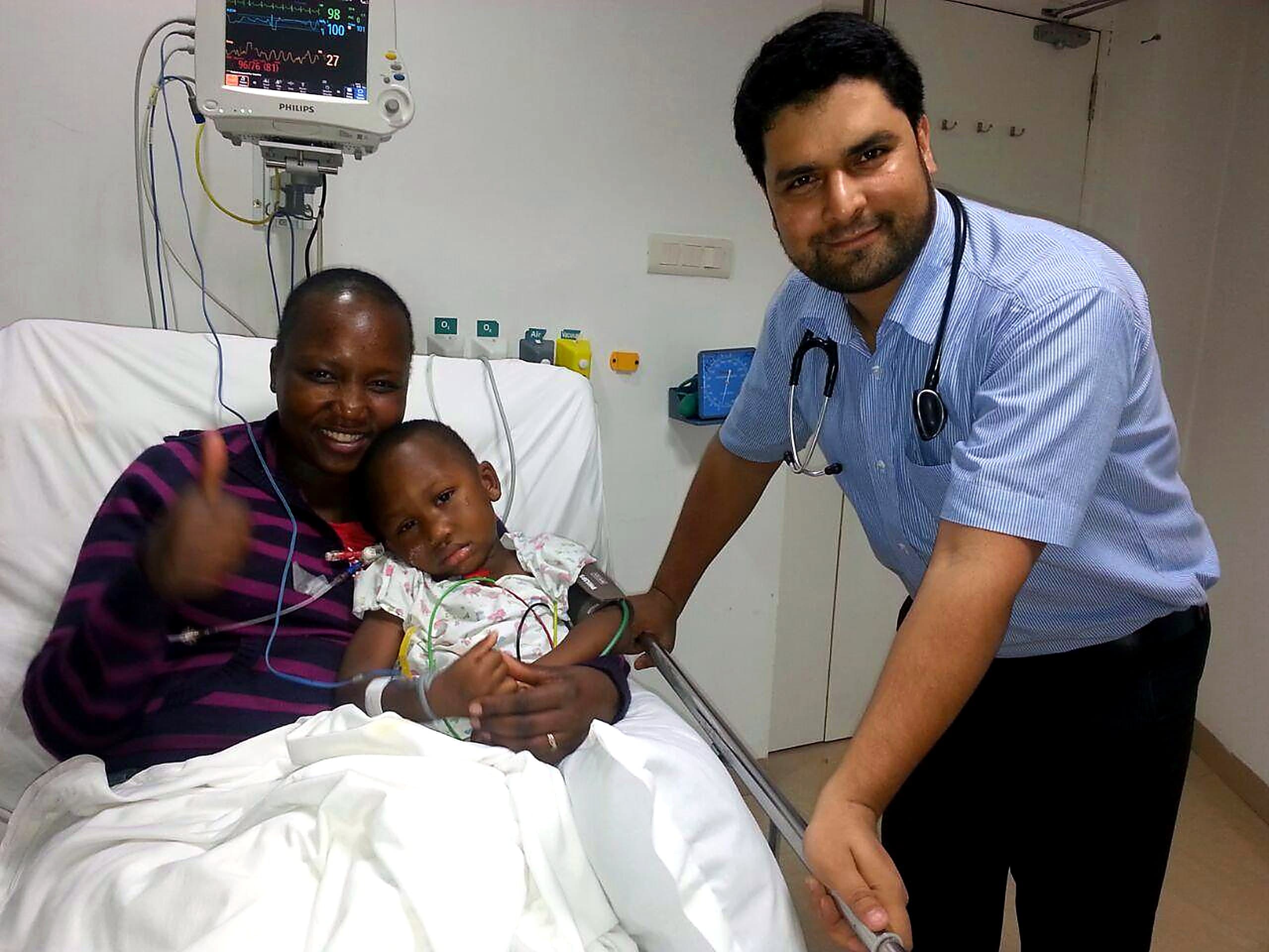 A doctor with a young patient and his mother during Subha Trust-supported hospital treatment
